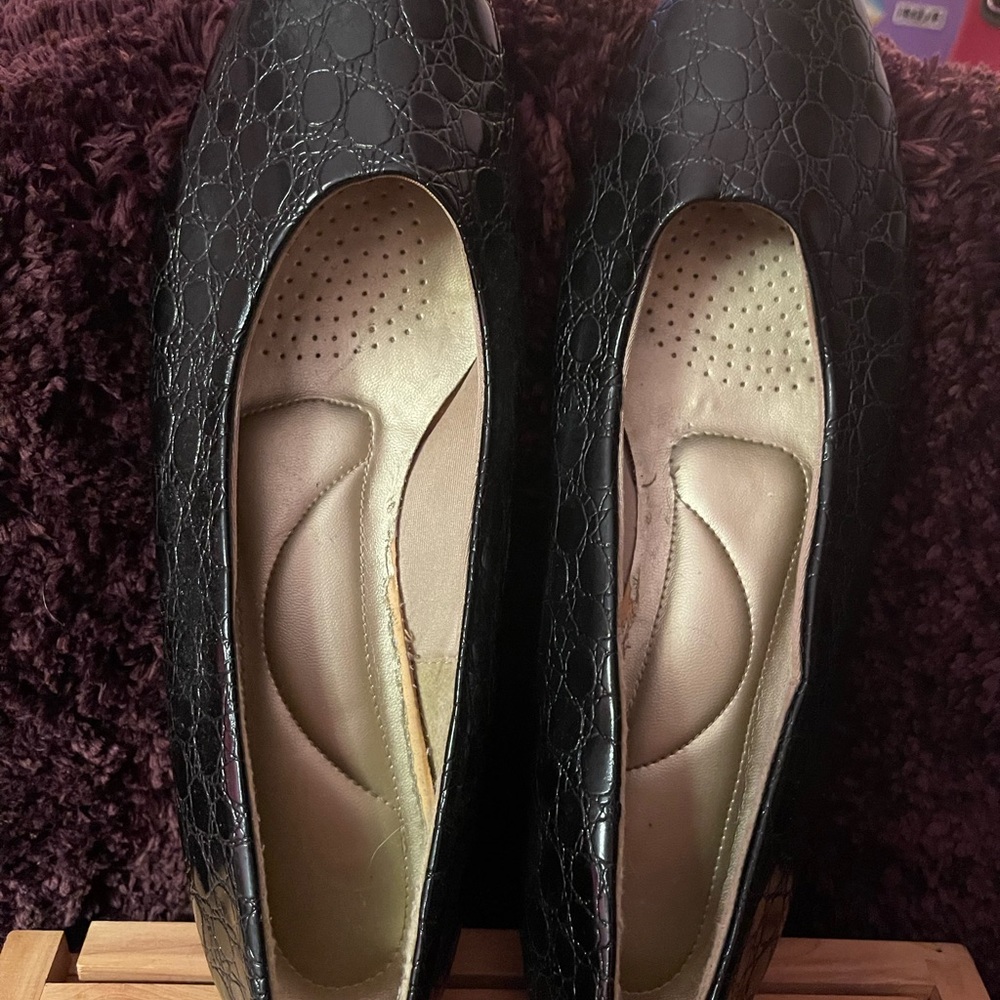 Black patent with design, excellent for dressing up your wardrobe